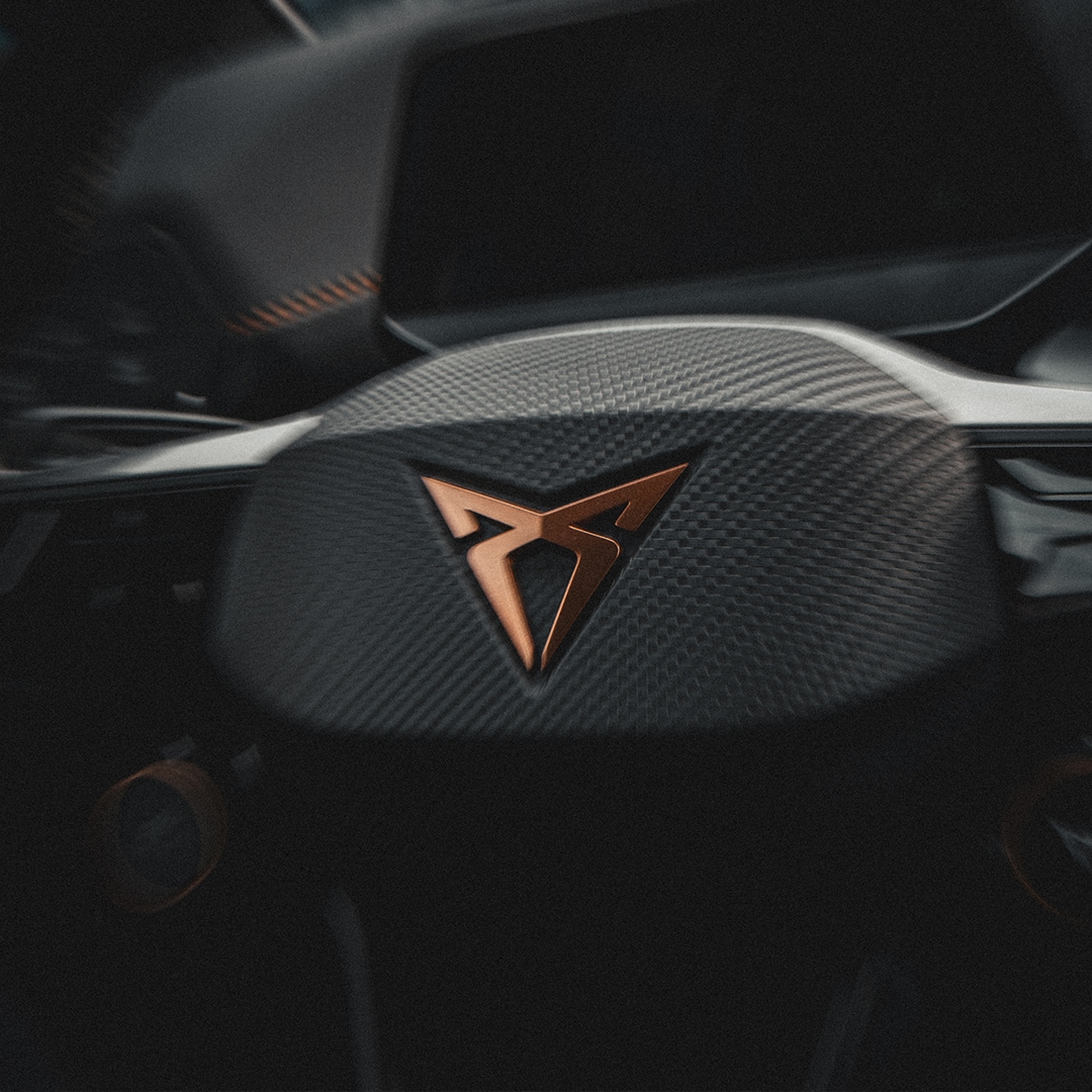 man using a smartphone in a city setting, representing general enquiries for cupra formentor. 