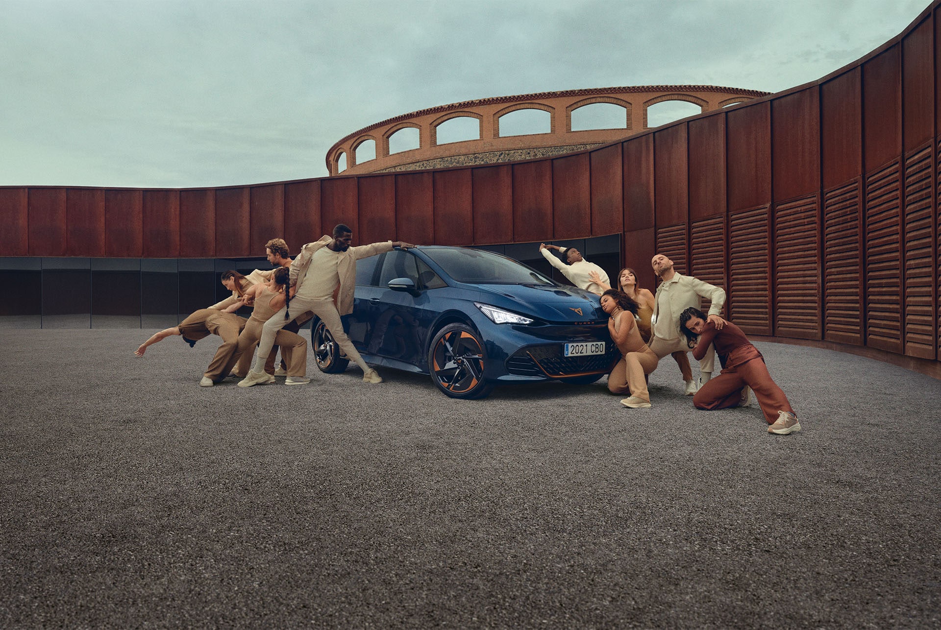 People posing around the CUPRA Born Aurora Blue colour