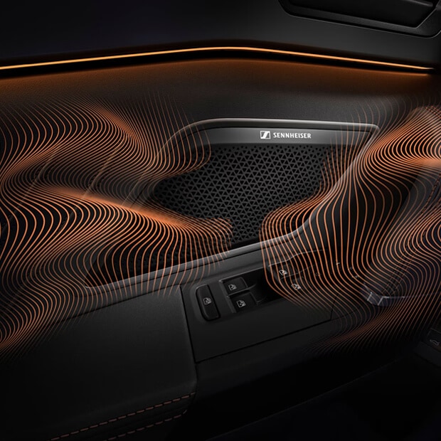 A close-up view of a CUPRA car's interior door panel, highlighting a speaker grille with the SENNHEISER logo. Abstract, flowing copper-colored lines overlay the image, symbolizing sound waves.