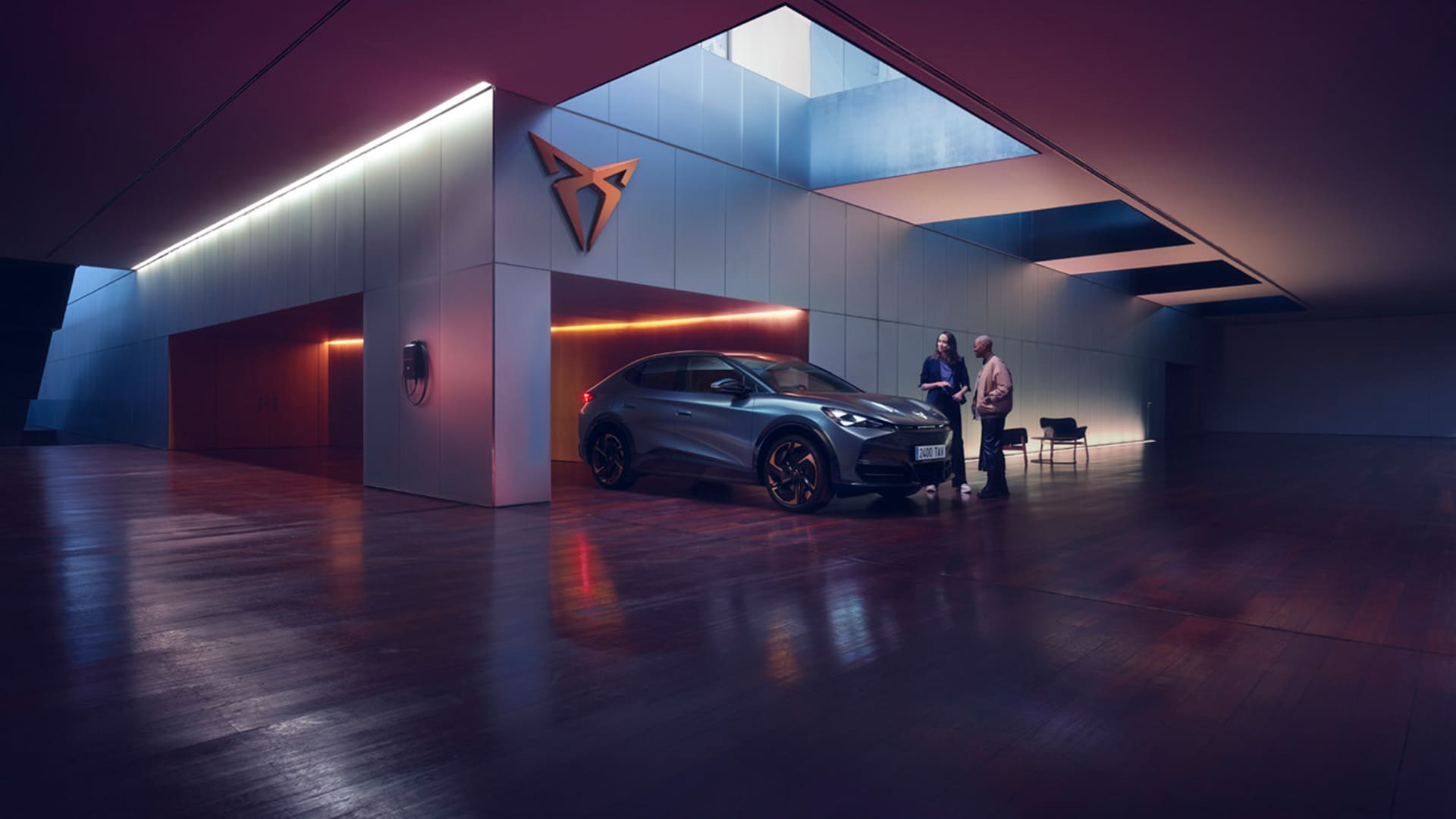 home charging station and cupra terramar in setting with concrete and sunset
